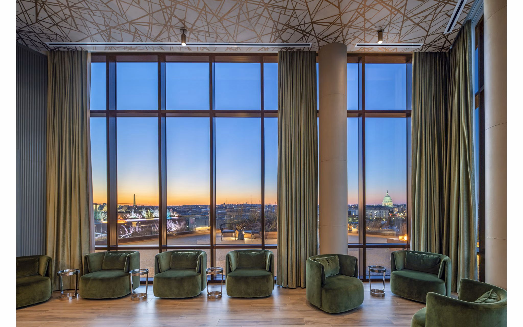 Clubhouse with modern design and cozy seating at Illume Apartments