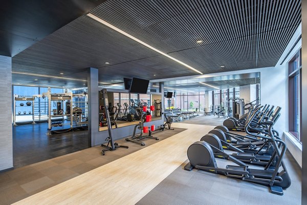 Modern fitness center featuring advanced equipment at Illume Apartments, perfect for residents seeking a healthy lifestyle