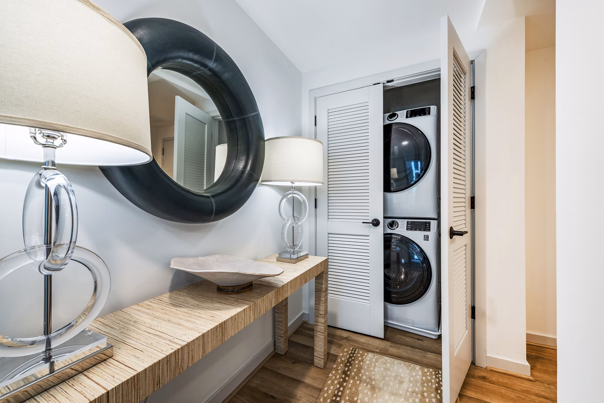 Laundry room featuring modern appliances at Illume Apartments, offered by Greystar luxury apartments