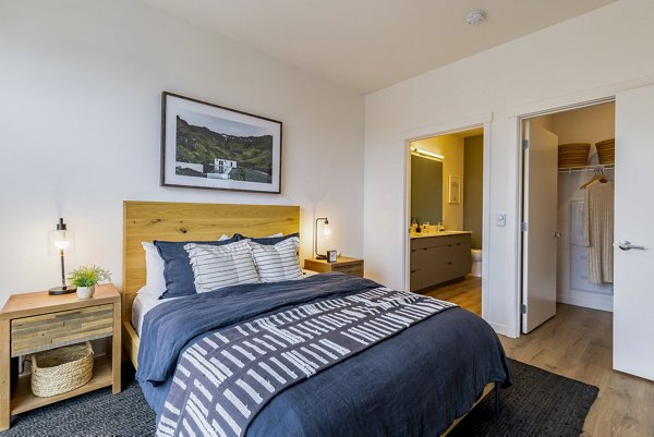 Modern bedroom with natural light at Verde Esterra Park Apartments