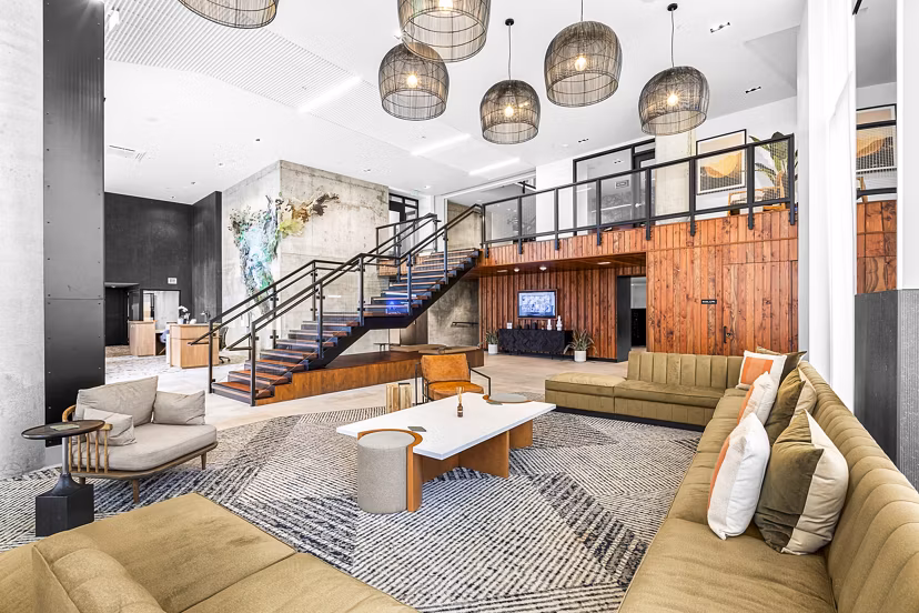 Contemporary clubhouse with cozy seating and modern decor at Verde Esterra Park Apartments