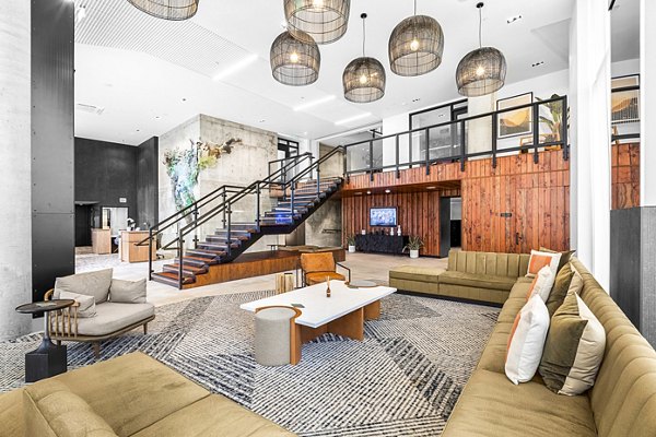 Contemporary clubhouse with cozy seating and modern decor at Verde Esterra Park Apartments