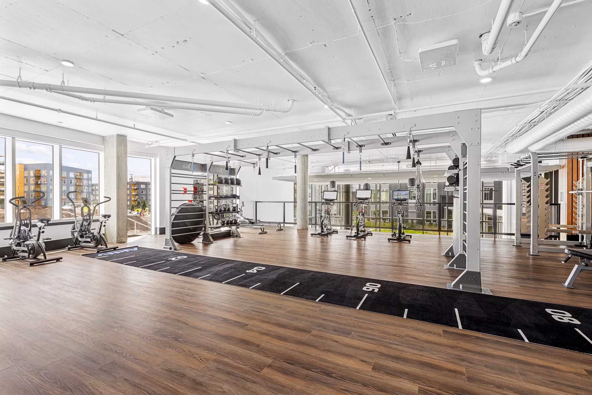 State-of-the-art fitness center with modern equipment at Verde Esterra Park Apartments in Redmond, ideal for active lifestyles