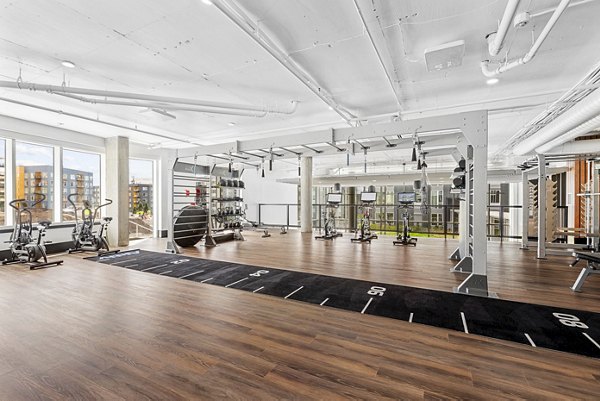 State-of-the-art fitness center with modern equipment at Verde Esterra Park Apartments in Redmond, ideal for active lifestyles
