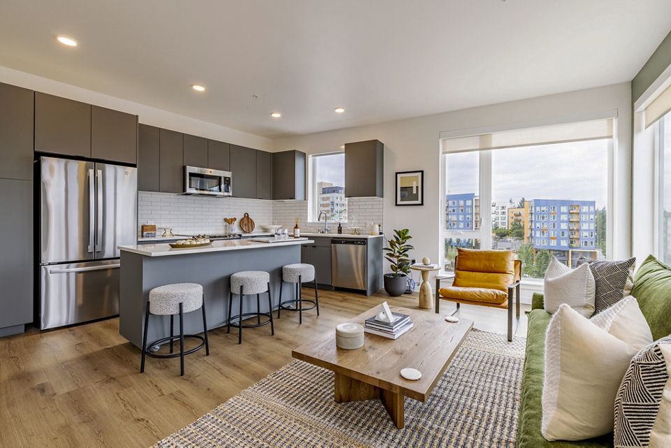 Spacious living room with modern furnishings in Verde Esterra Park Apartments, perfect for luxury living near Seattle's tech hub