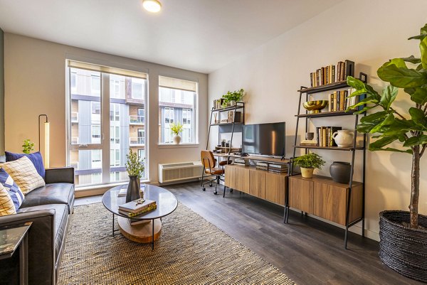 Spacious living room with modern decor in Verde Esterra Park Apartments