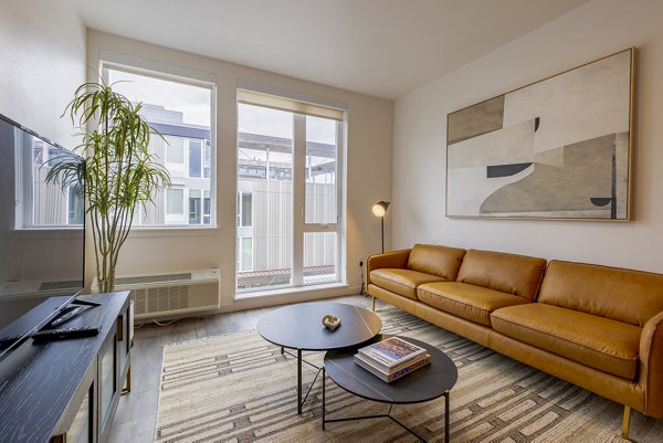 Spacious living room with modern furnishings in Verde Esterra Park Apartments