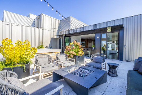 Outdoor patio with communal fire pit at Verde Esterra Park Apartments