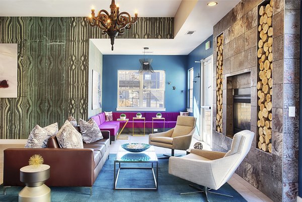 Clubhouse with modern furnishings at Prosper Place Apartments featuring luxury amenities in a premier location