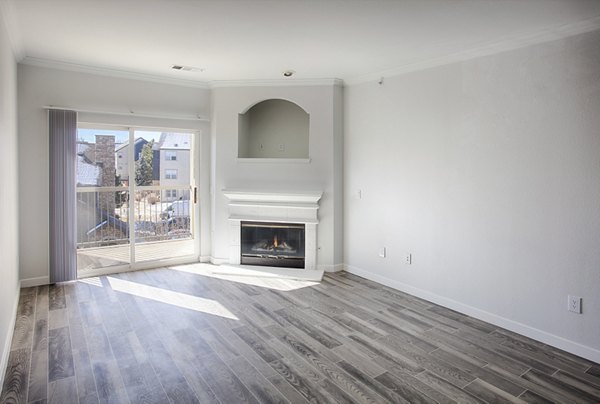 Spacious living room with modern furniture at Prosper Place Apartments