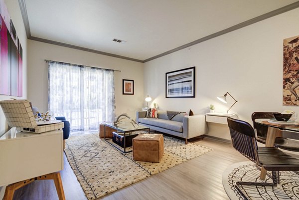 Spacious living room with modern decor at Prosper Place Apartments offering comfort and style