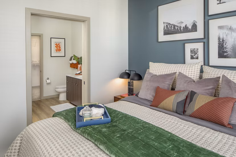 Cozy bedroom with plush bedding and modern decor at The Dylan Apartments