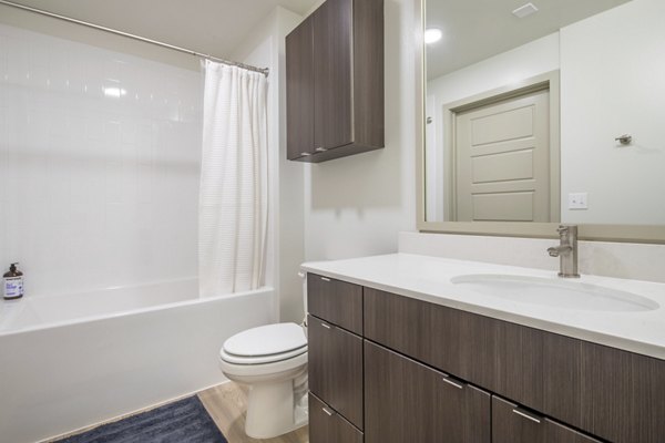 Bathroom with sleek design and modern fixtures at The Dylan Apartments, Greystar luxury apartments