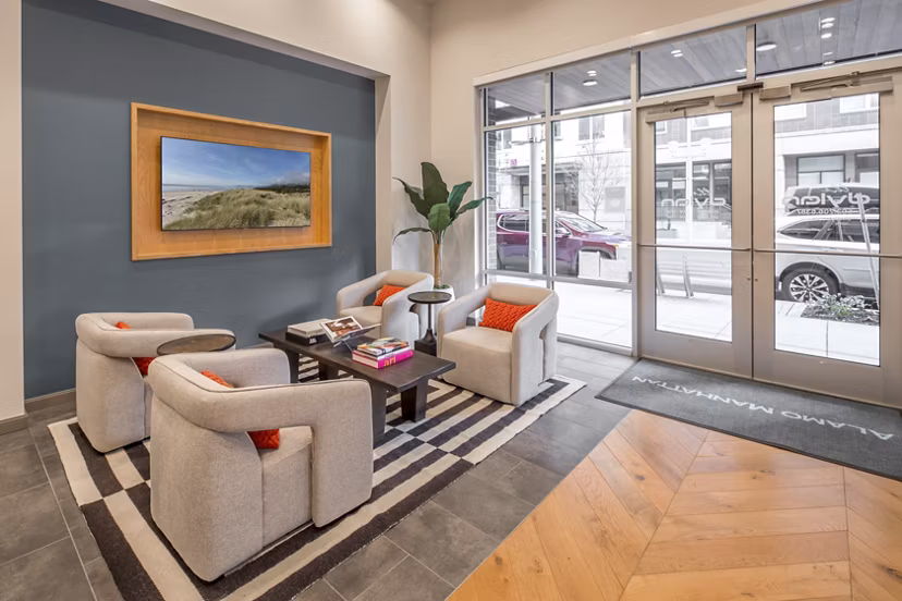 Stylish clubhouse at The Dylan Apartments featuring modern design and cozy seating