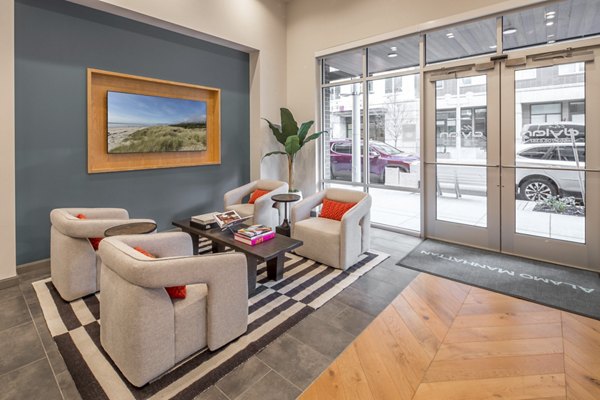 Stylish clubhouse at The Dylan Apartments featuring modern design and cozy seating