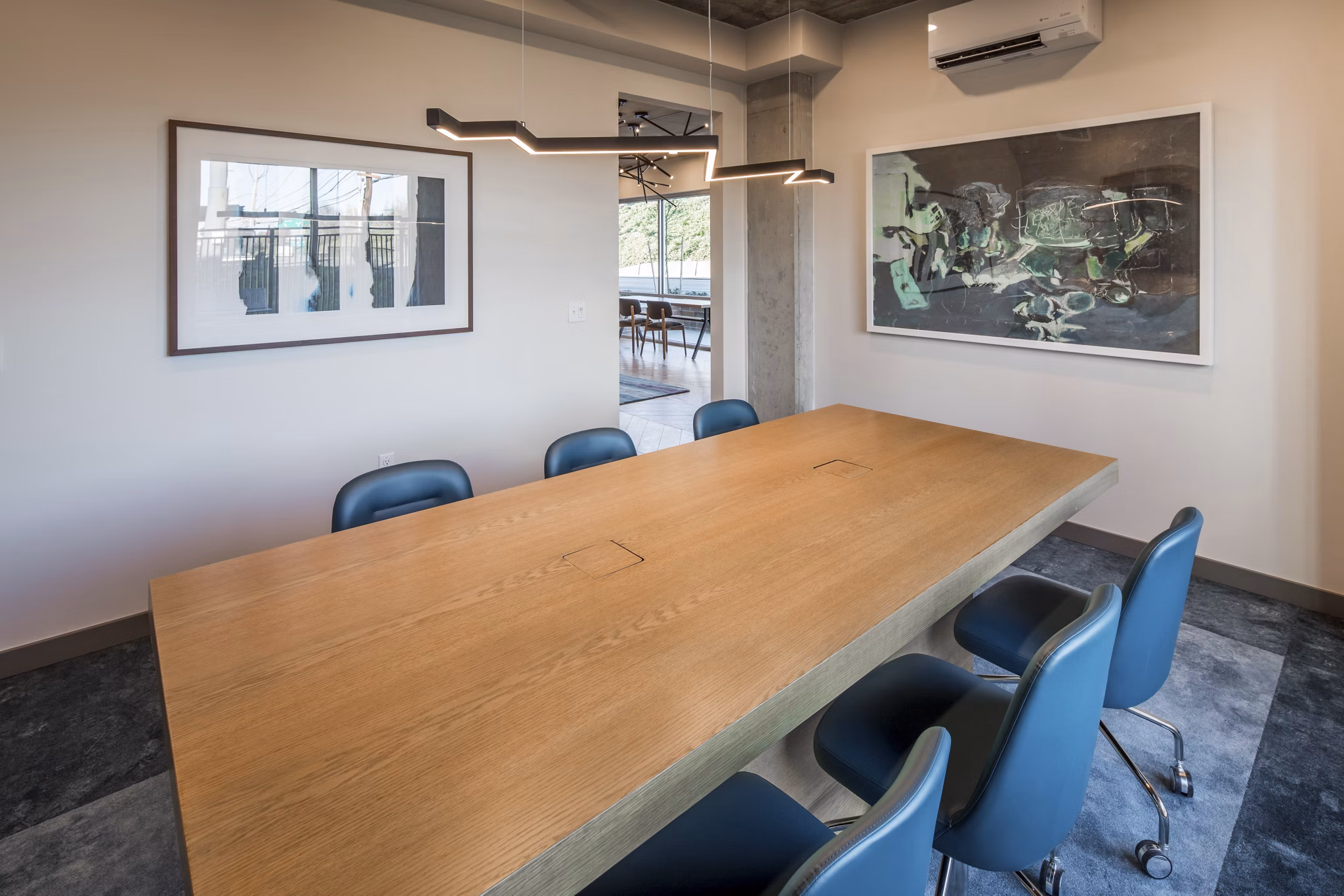 Modern meeting facility with stylish furnishings at The Dylan Apartments, perfect for business gatherings in a luxury environment