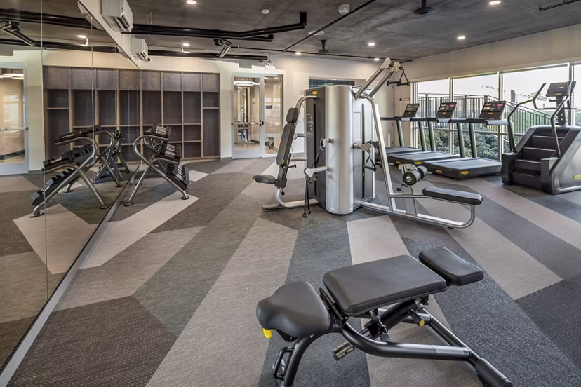 Modern fitness center with state-of-the-art equipment at The Dylan Apartments in a luxury  community