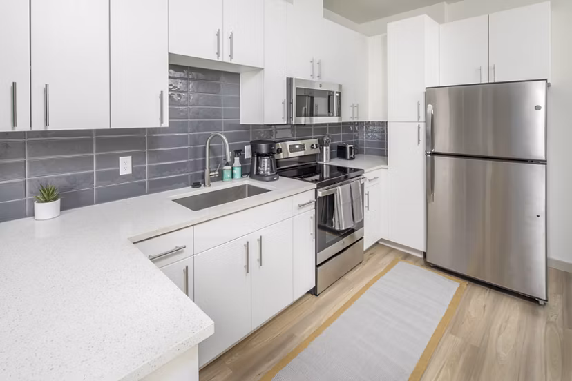 Modern kitchen with stainless steel appliances at The Dylan Apartments