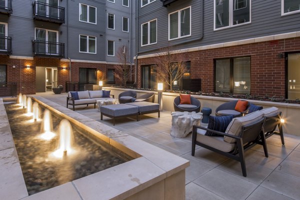 Cozy fire pit at The Dylan Apartments, perfect for luxury outdoor gatherings