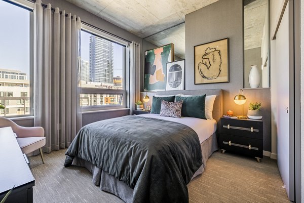 Cozy bedroom with sleek furniture at The Waverly Apartments
