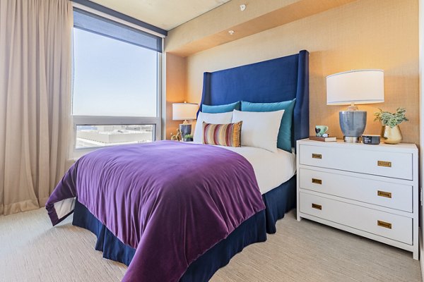 Spacious bedroom with modern decor at The Waverly Apartments luxury property