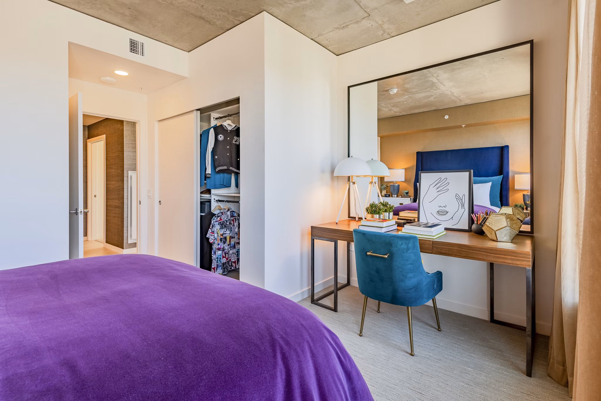 Bedroom with modern decor and natural light at The Waverly Apartments, luxury living in a serene environment