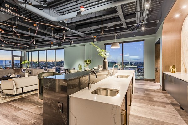 Clubhouse featuring modern decor and plush seating at The Waverly Apartments in Greystar's luxury living community