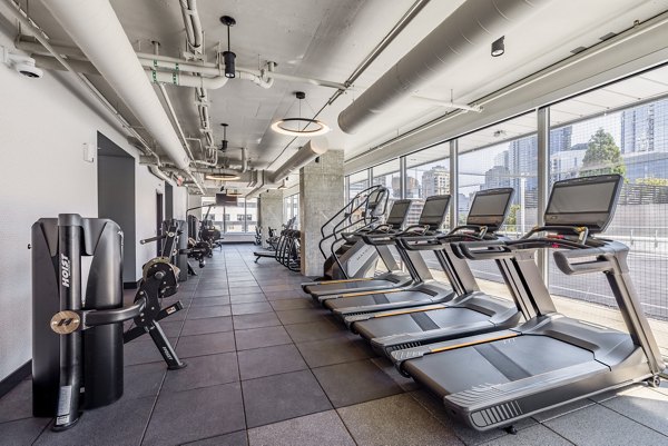 State-of-the-art fitness center with modern equipment at The Waverly Apartments