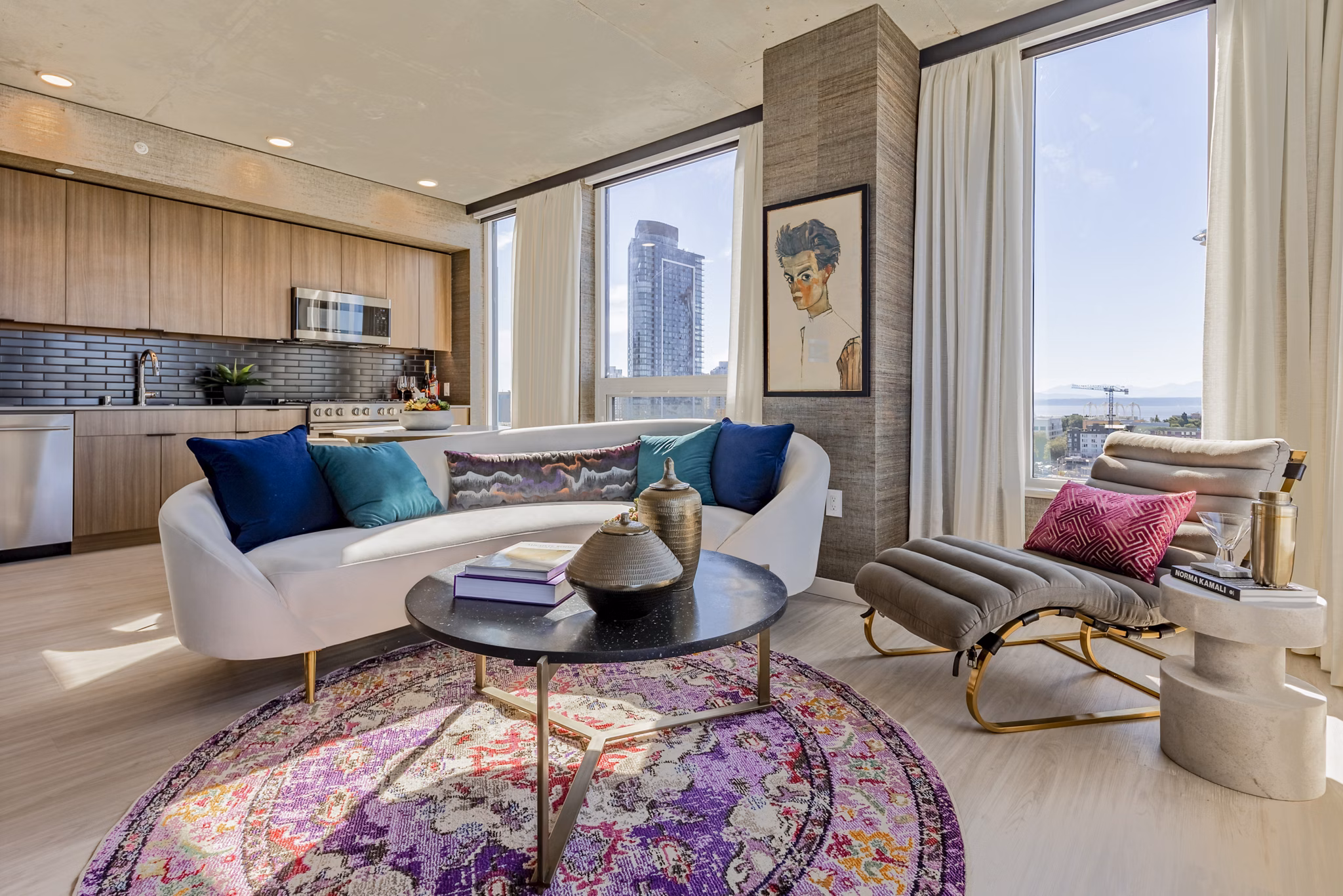 Modern living room with elegant decor and large windows at The Waverly Apartments, offering luxurious space and comfort in urban living