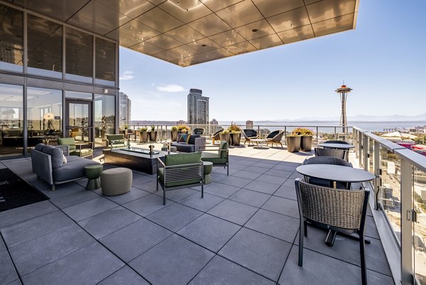 Inviting patio with modern seating at The Waverly Apartments, perfect for relaxation and outdoor dining