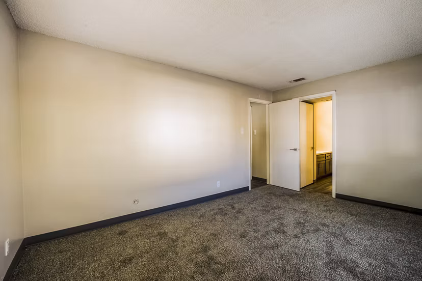 Elegant bedroom with modern design at Calero Apartments