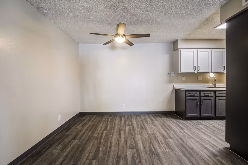Dining room featuring elegant design and natural lighting at Calero Apartments