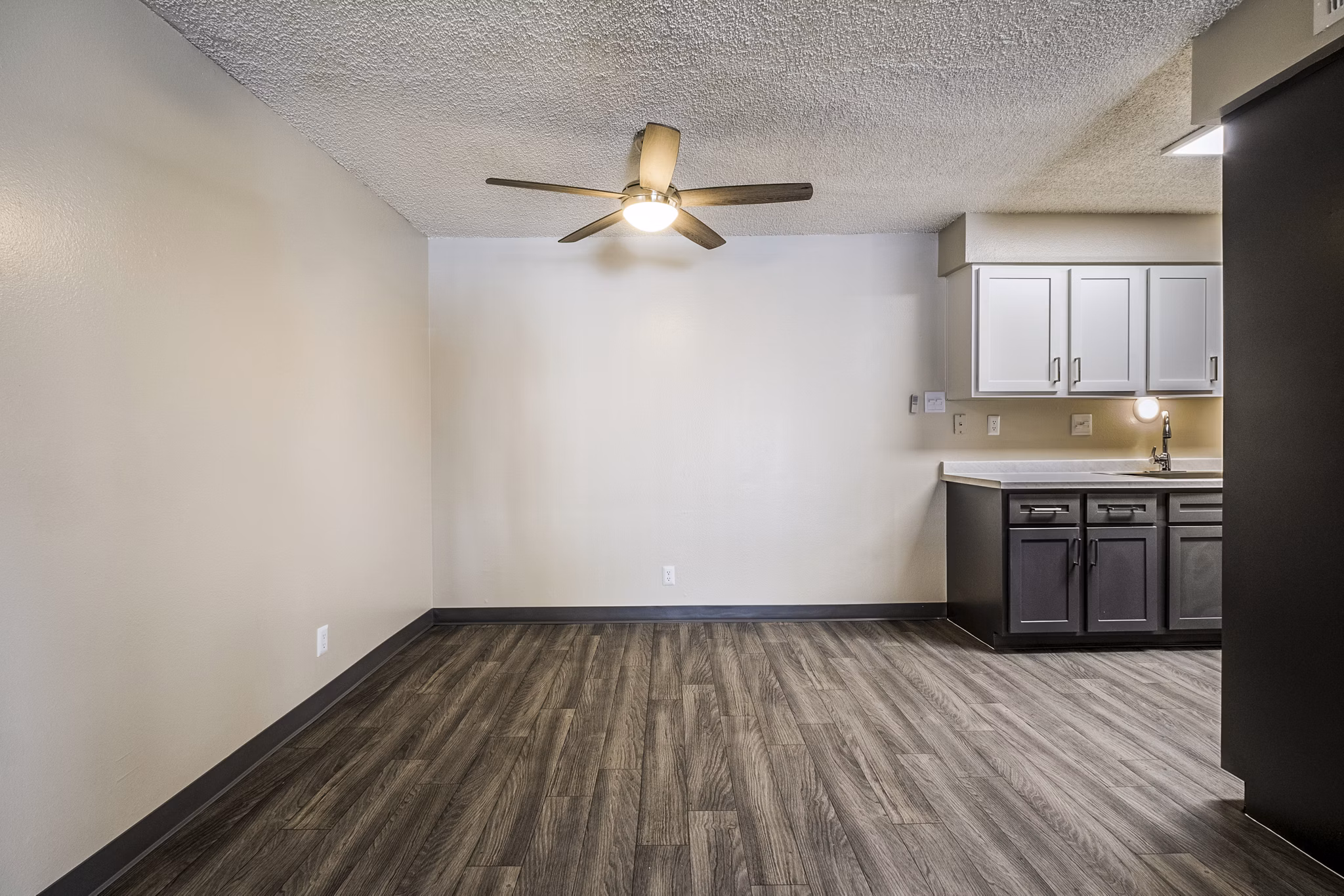 Dining room featuring elegant design and natural lighting at Calero Apartments