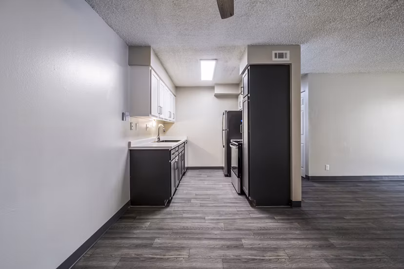 Modern kitchen with stainless steel appliances at Calero Apartments