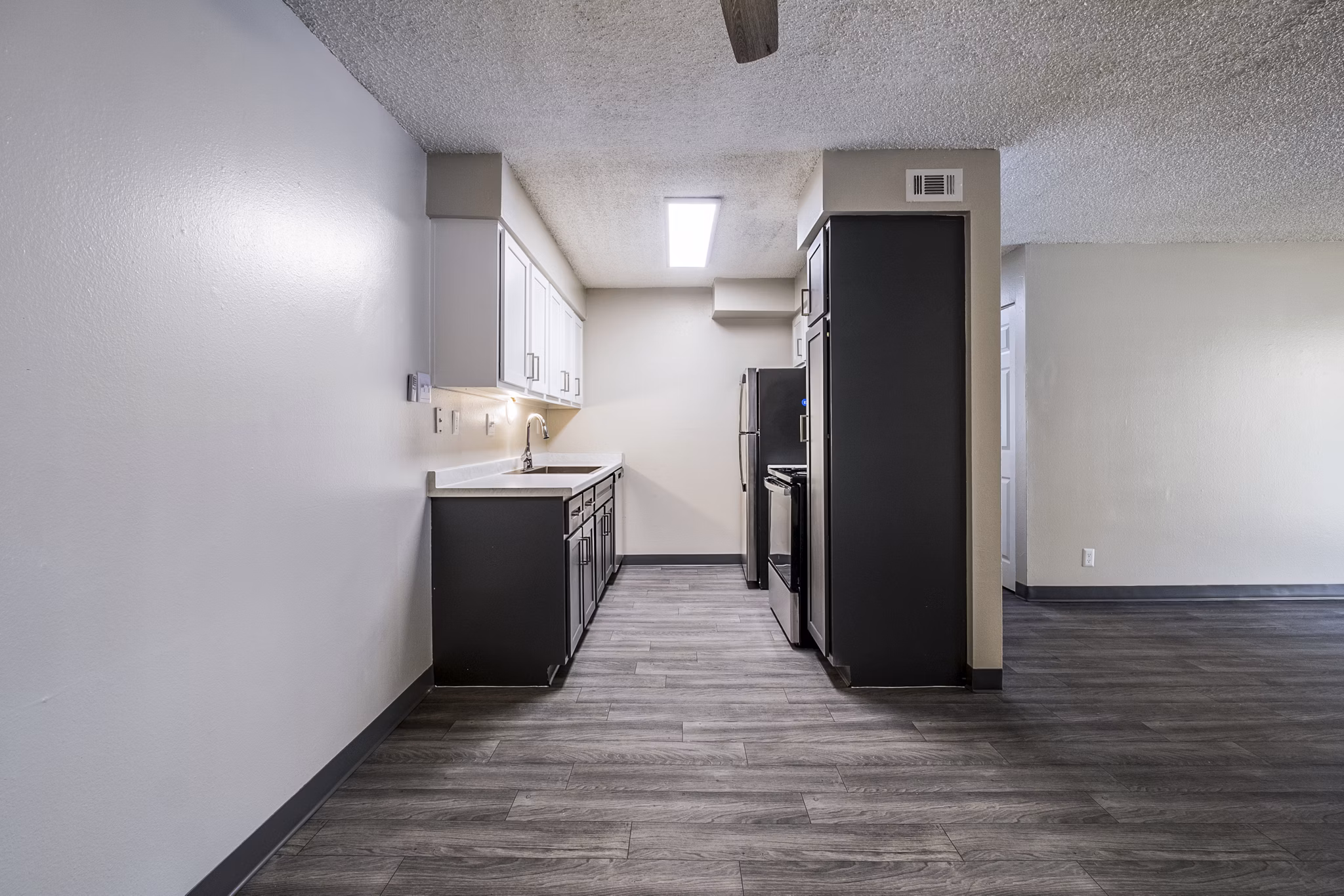 Modern kitchen with stainless steel appliances at Calero Apartments
