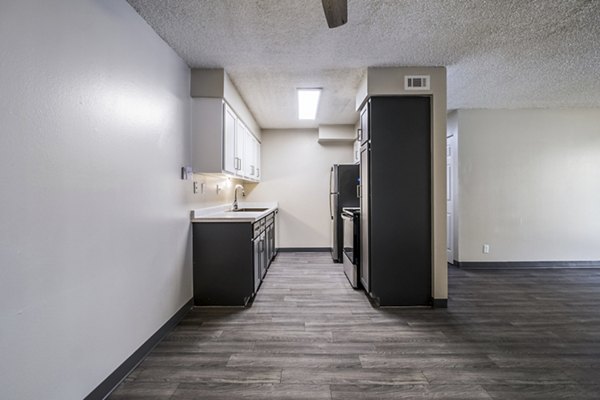 Modern kitchen with stainless steel appliances at Calero Apartments