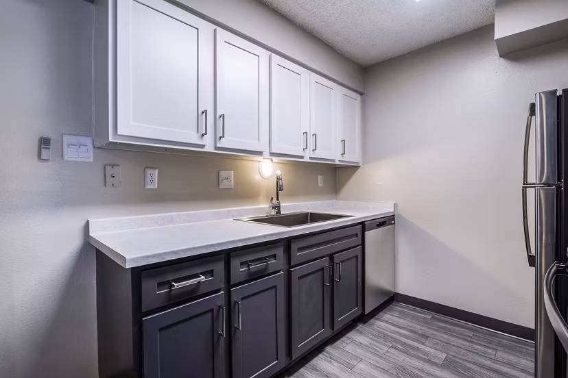 Modern kitchen with stainless steel appliances at Calero Apartments