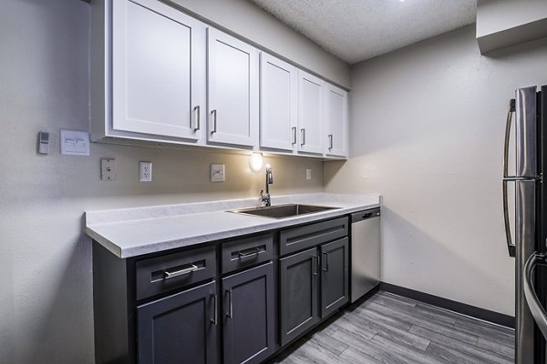 Modern kitchen with stainless steel appliances at Calero Apartments