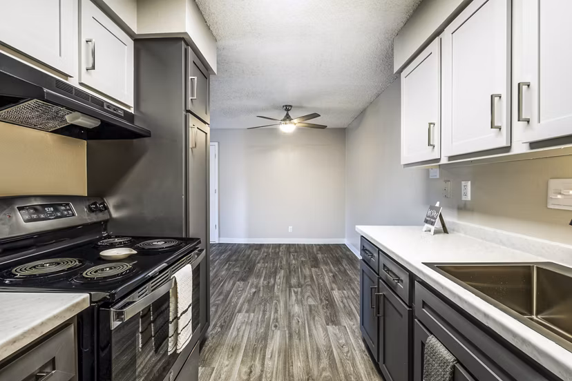 Modern kitchen with stainless steel appliances at Calero Apartments