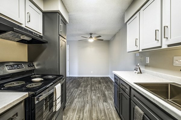 Modern kitchen with stainless steel appliances at Calero Apartments