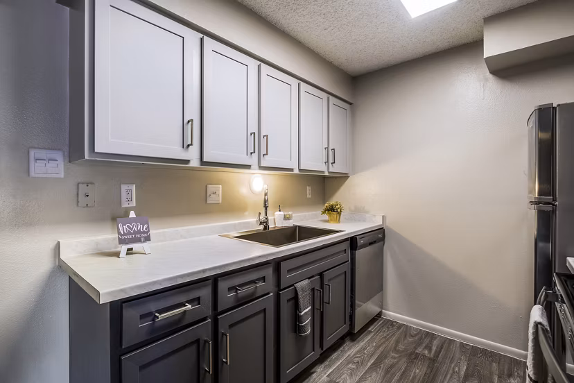 Modern kitchen with stainless steel appliances at Calero Apartments