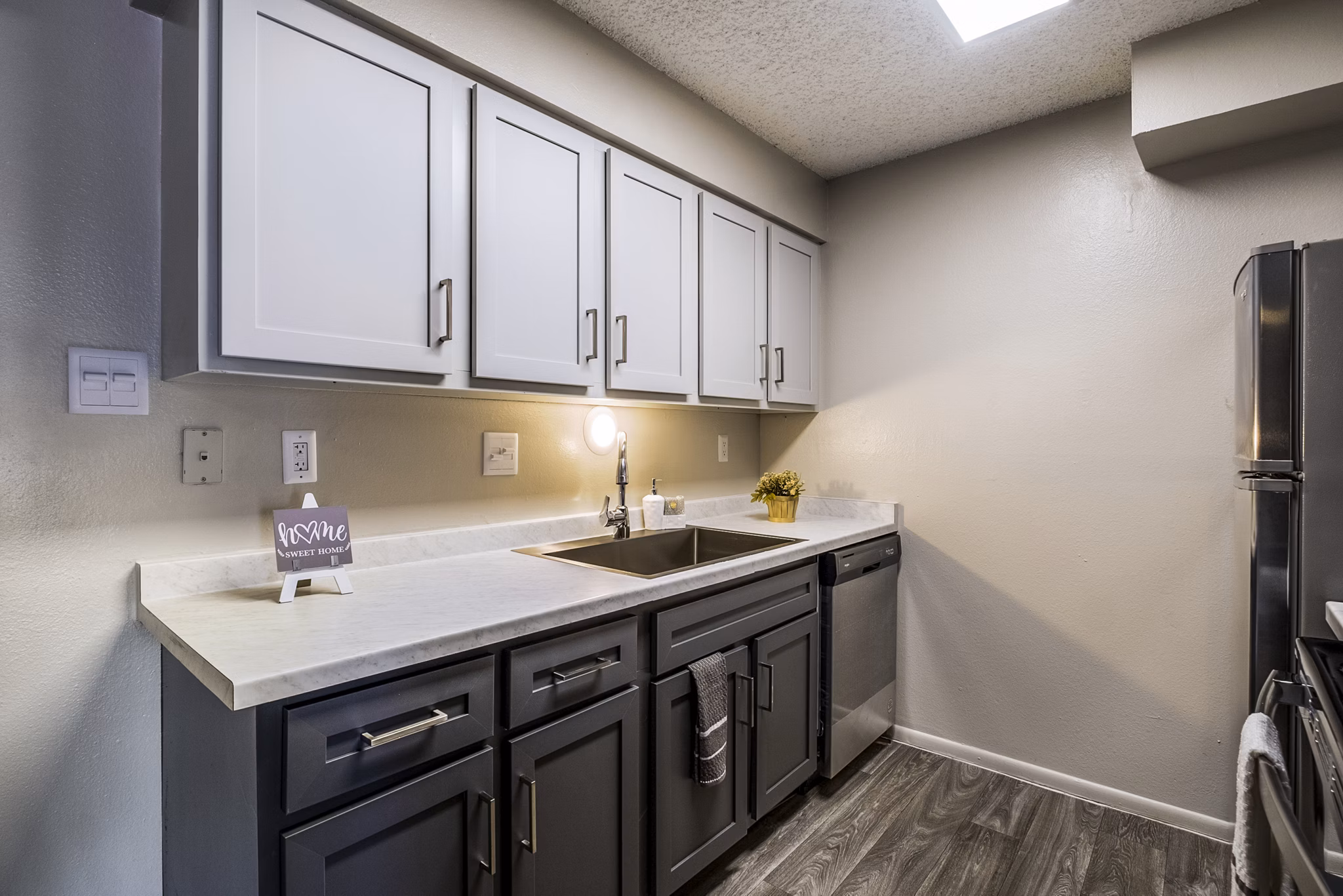 Modern kitchen with stainless steel appliances at Calero Apartments