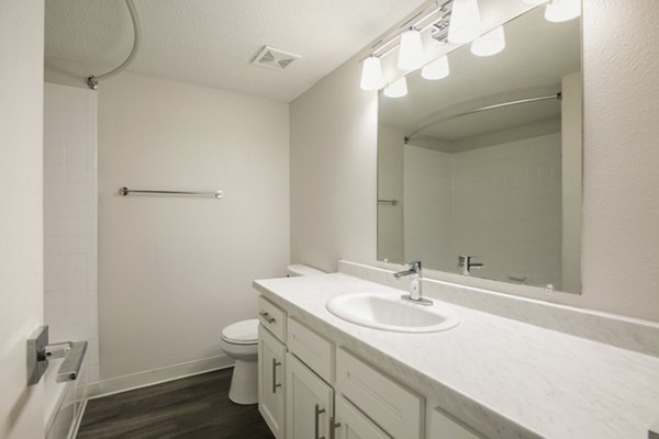 Bathroom featuring modern fixtures and spacious layout at Milo Apartments