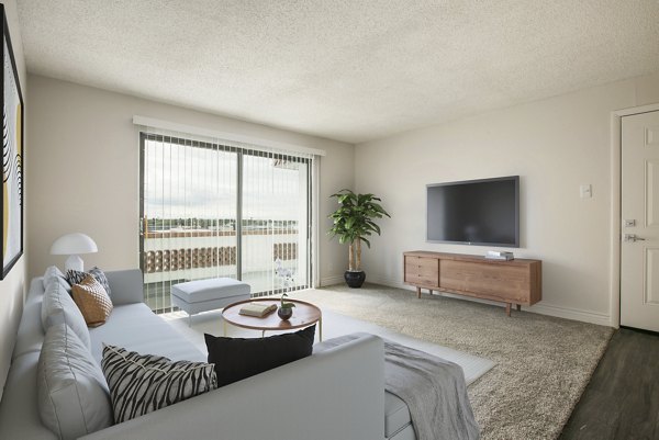 Elegant living room with modern furnishings in Milo Apartments