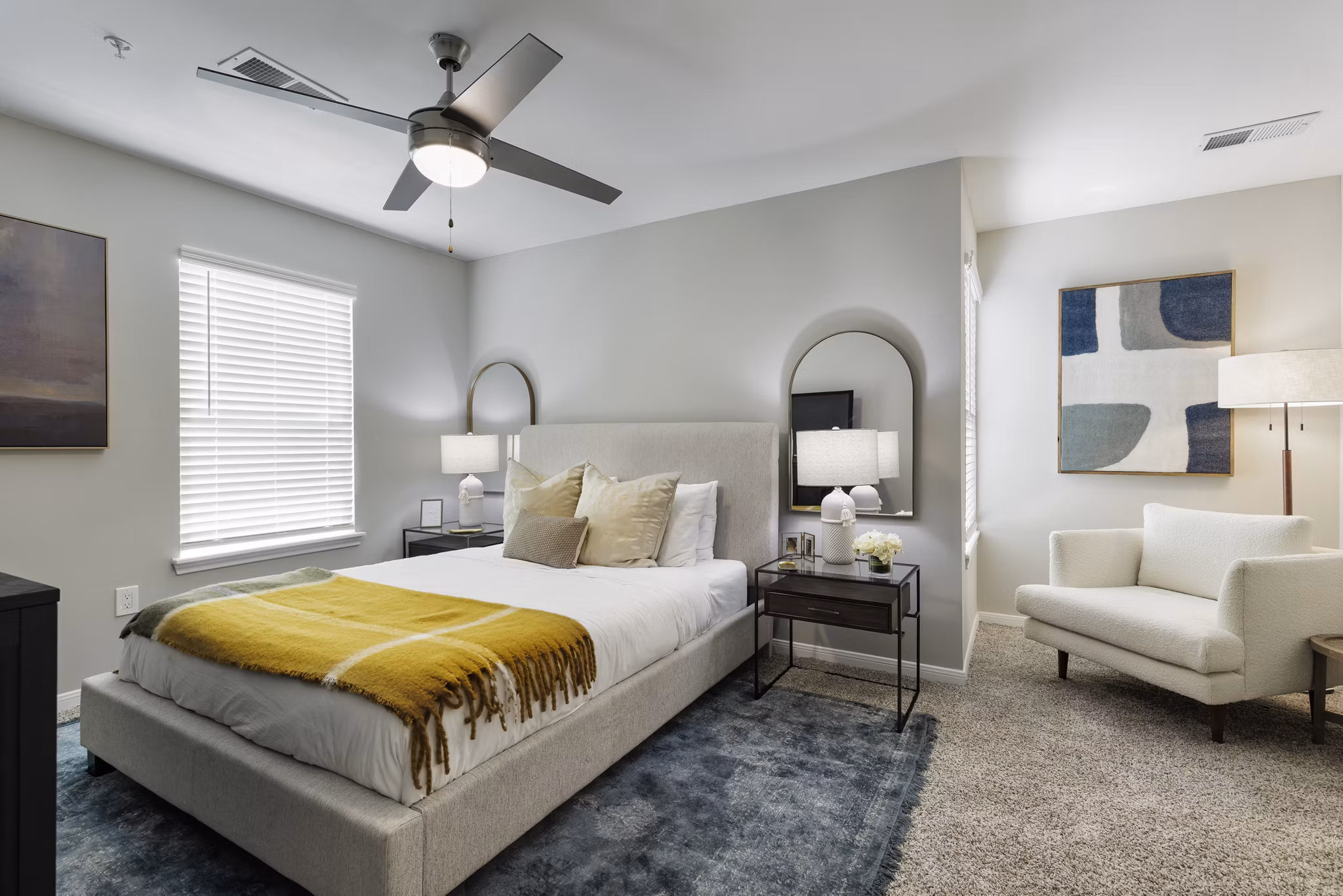 Cozy bedroom with modern decor at Oltera in SoEast Apartments, luxury living by Greystar