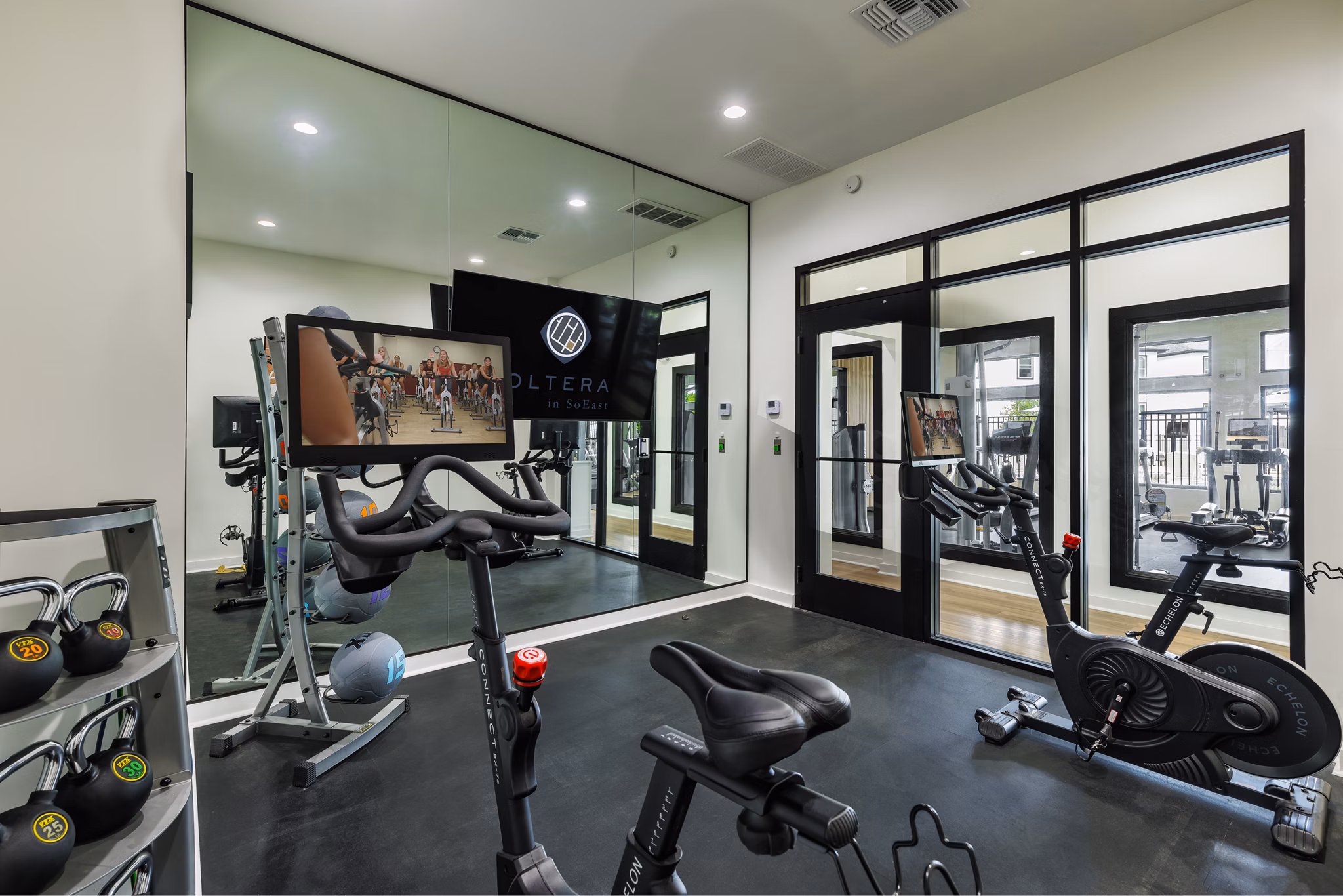 Modern fitness center with state-of-the-art equipment at Oltera in SoEast Apartments, promoting a healthy lifestyle for residents