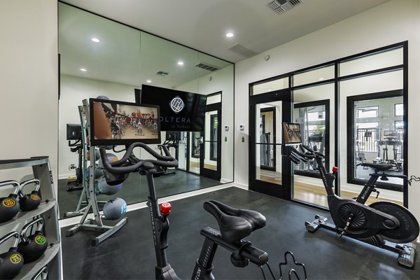Modern fitness center with state-of-the-art equipment at Oltera in SoEast Apartments, promoting a healthy lifestyle for residents