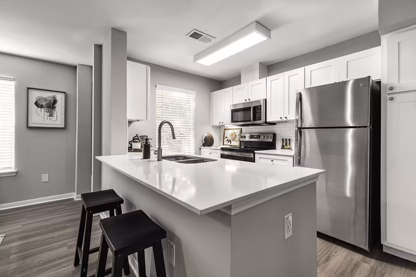 Modern kitchen with stainless steel appliances at Oltera in SoEast Apartments