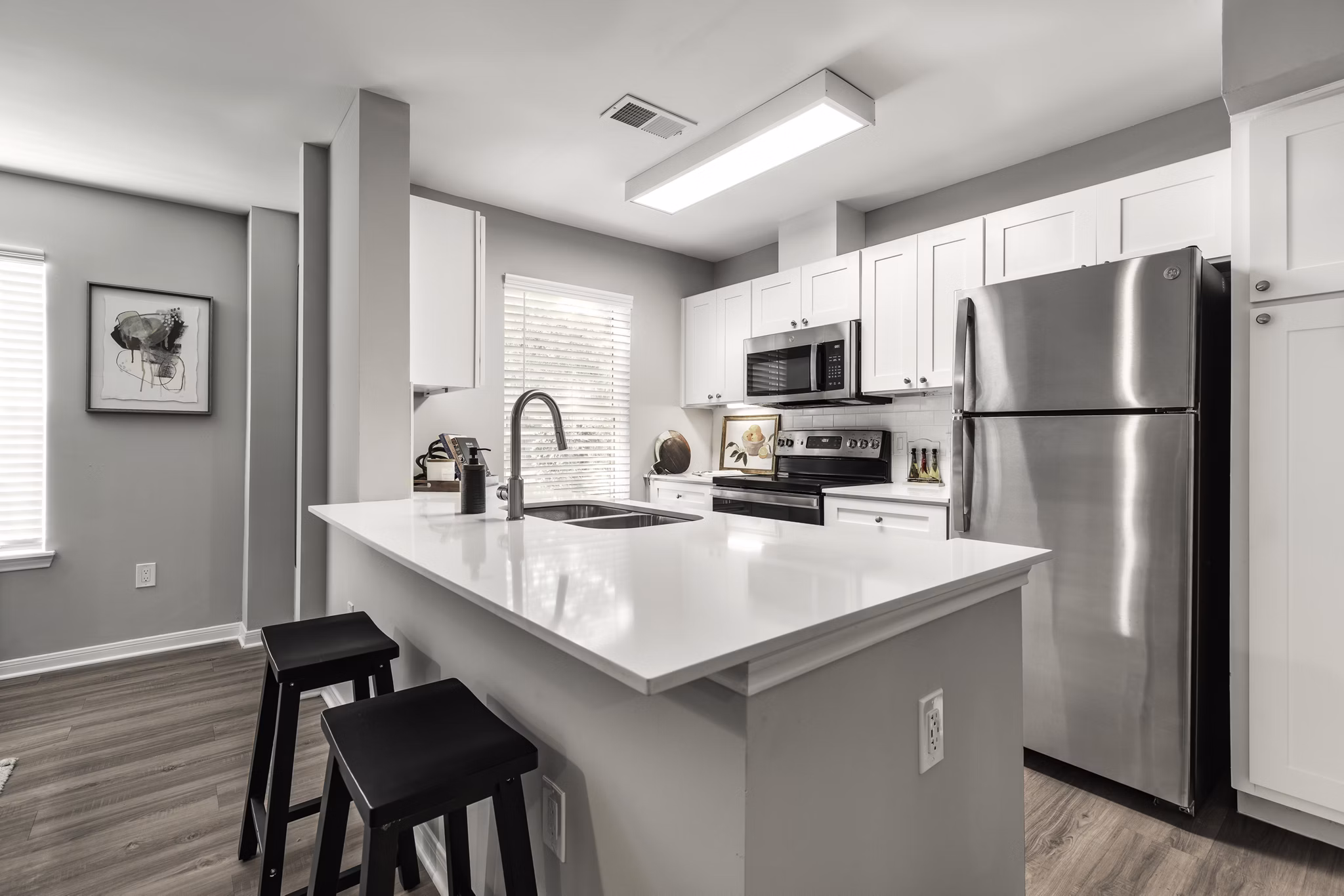 Modern kitchen with stainless steel appliances at Oltera in SoEast Apartments