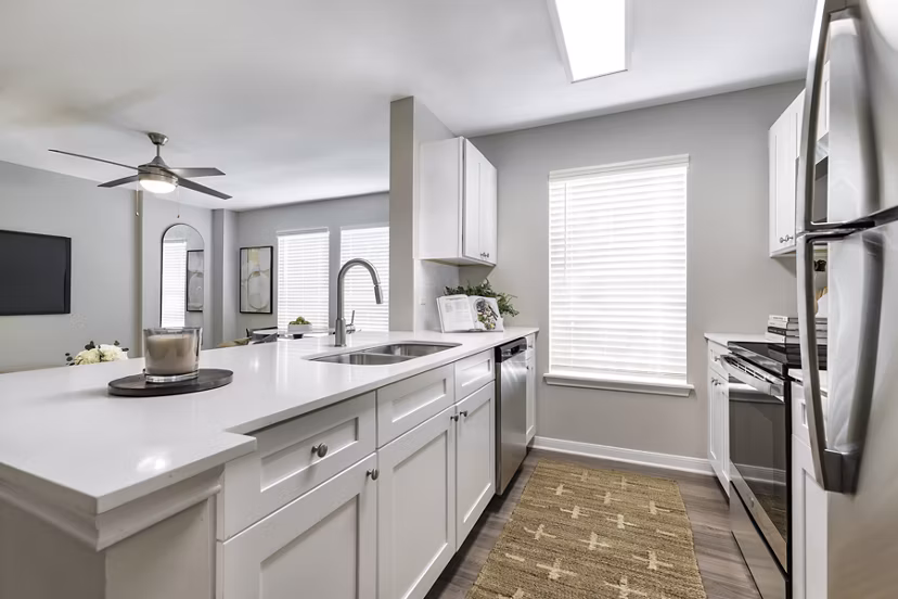 Modern kitchen featuring stainless steel appliances at Oltera in SoEast Apartments, perfect for luxury living in a vibrant community